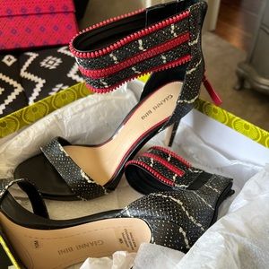 Black, red and white heels. Never worn.